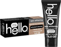 Toothpaste box with charcoal tube, both featuring black and tan details