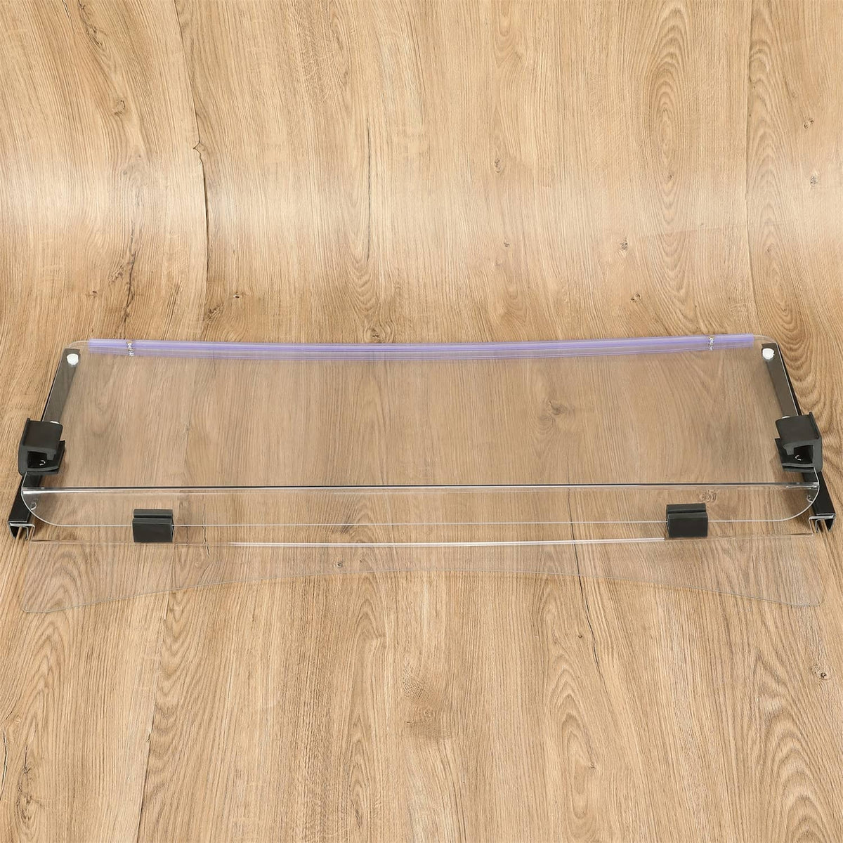 Clear folding windshield with black side rails and metal mounting feet