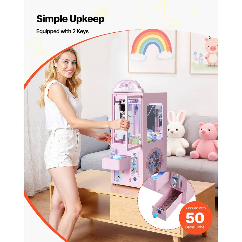 Pink claw crane arcade machine with claw mechanism and illuminated prize platform