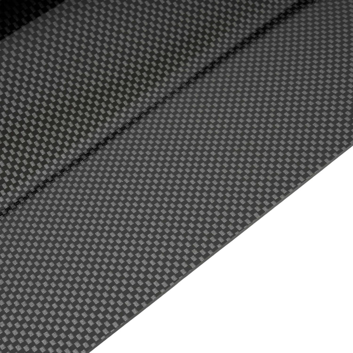 Carbon fiber style dash board cover texture close-up on dark gray surface