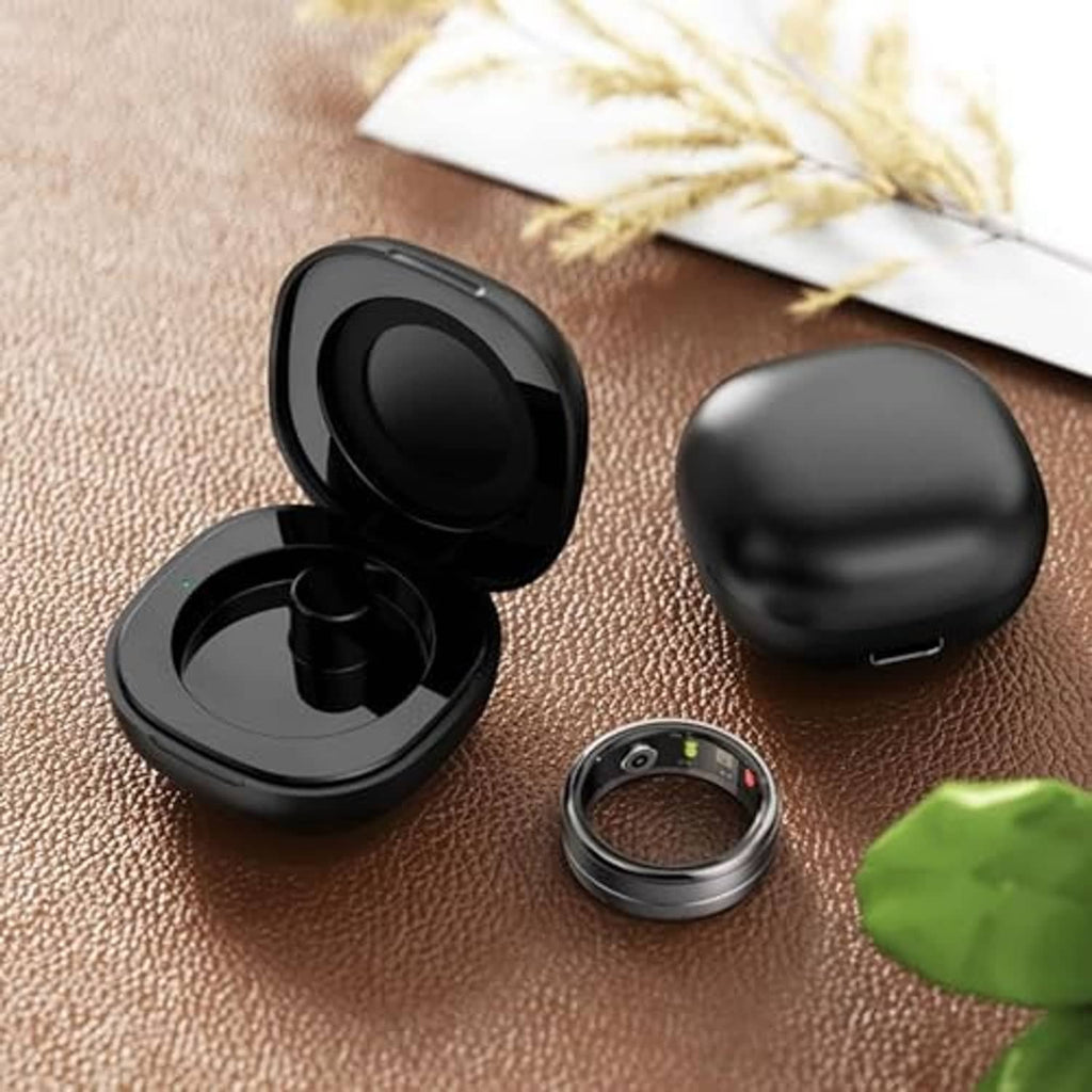 Black magnetic charging case with charging cradle, matching smart ring, and cable