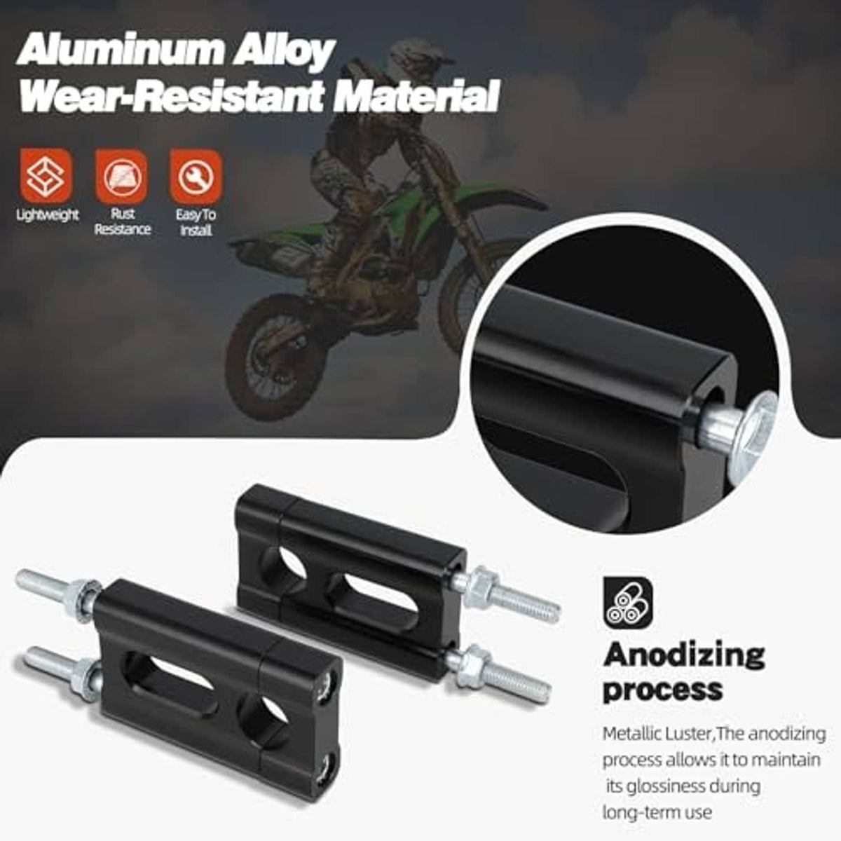 Black aluminum handlebar riser clamp with silver bolts, close-up side view