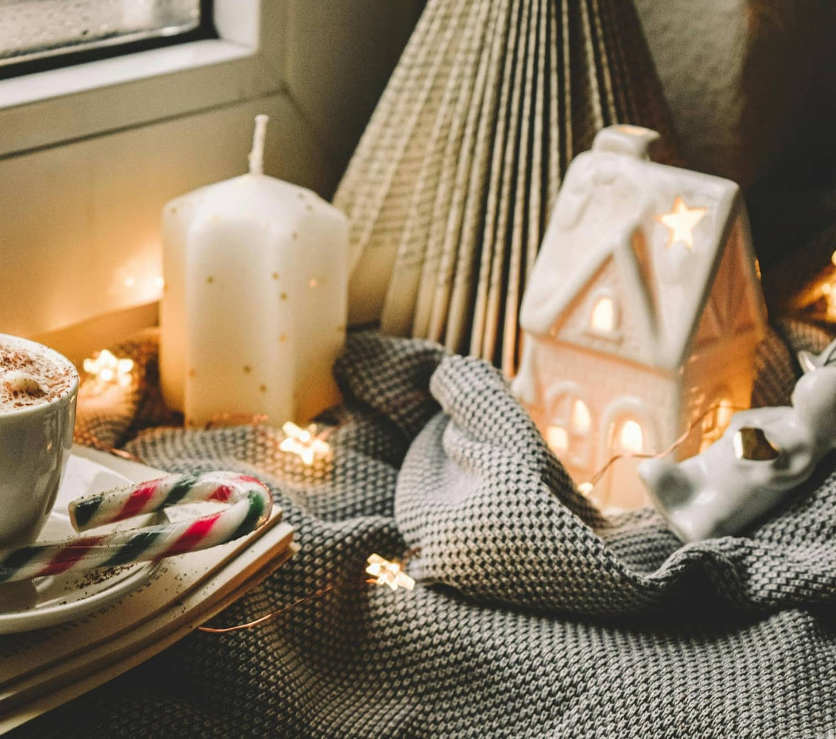 White pillar candles with soft warm glowing accents