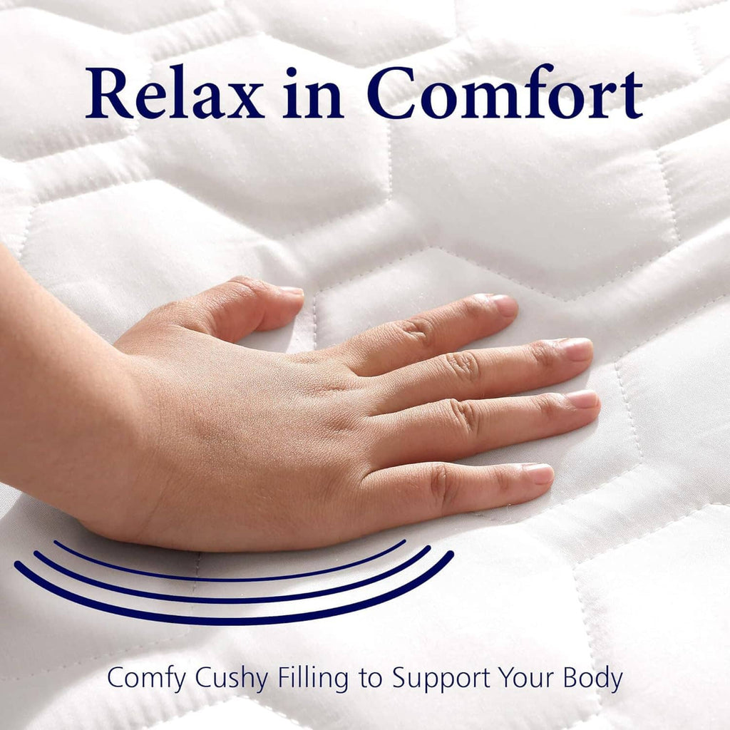 White quilted mattress pad surface with hands pressing for comfort