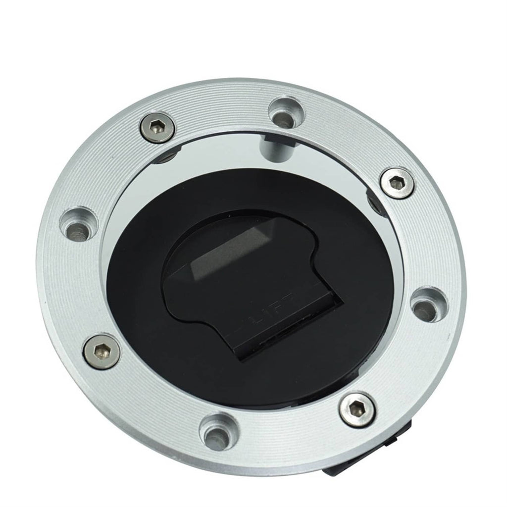 Silver ignition lock cap with black center key slot and mounting screws
