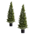 Artificial cedar-style topiary trees in black planters, two compact green conical shapes