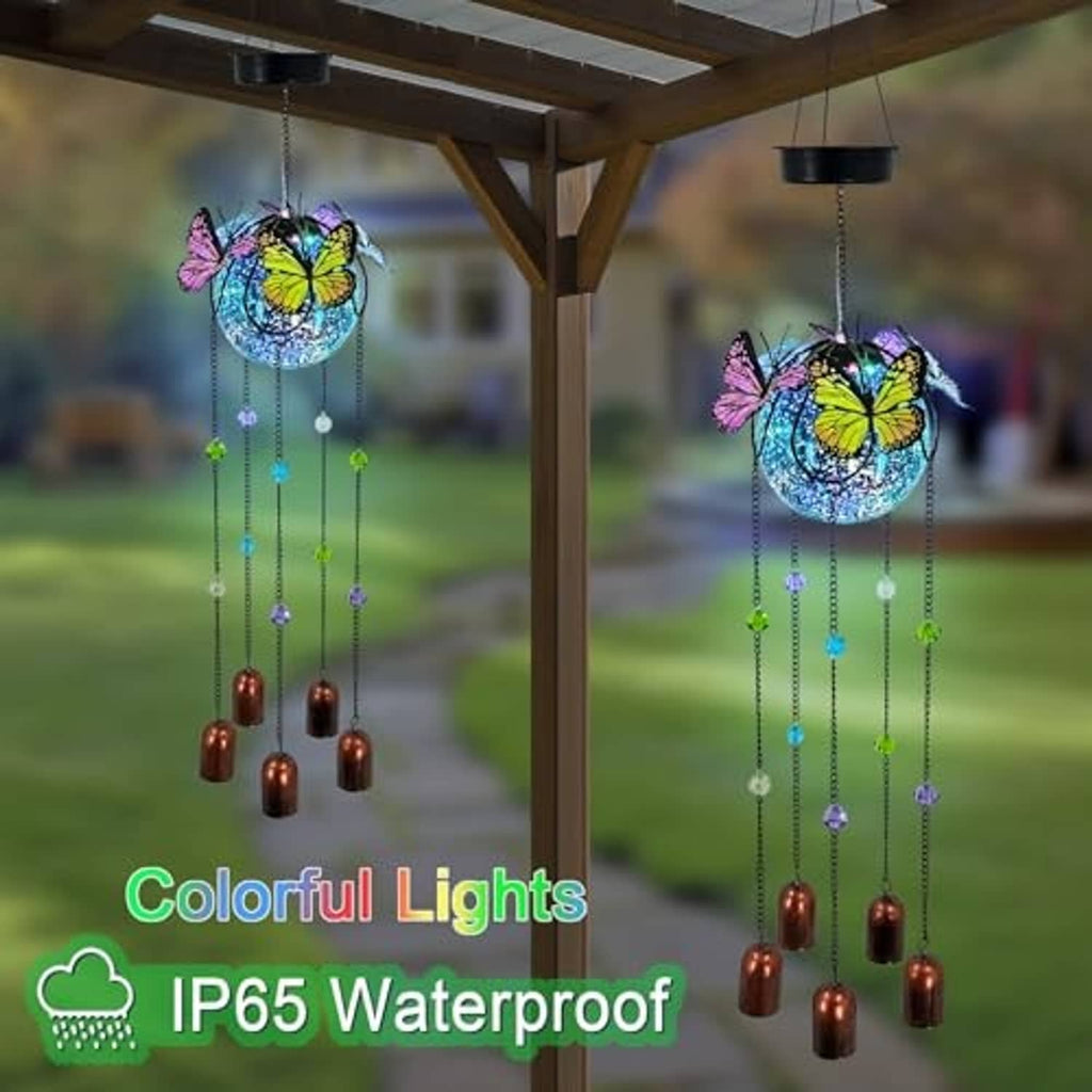 Butterfly wind chime solar light with blue orb, colored bead chains, and copper bell drops