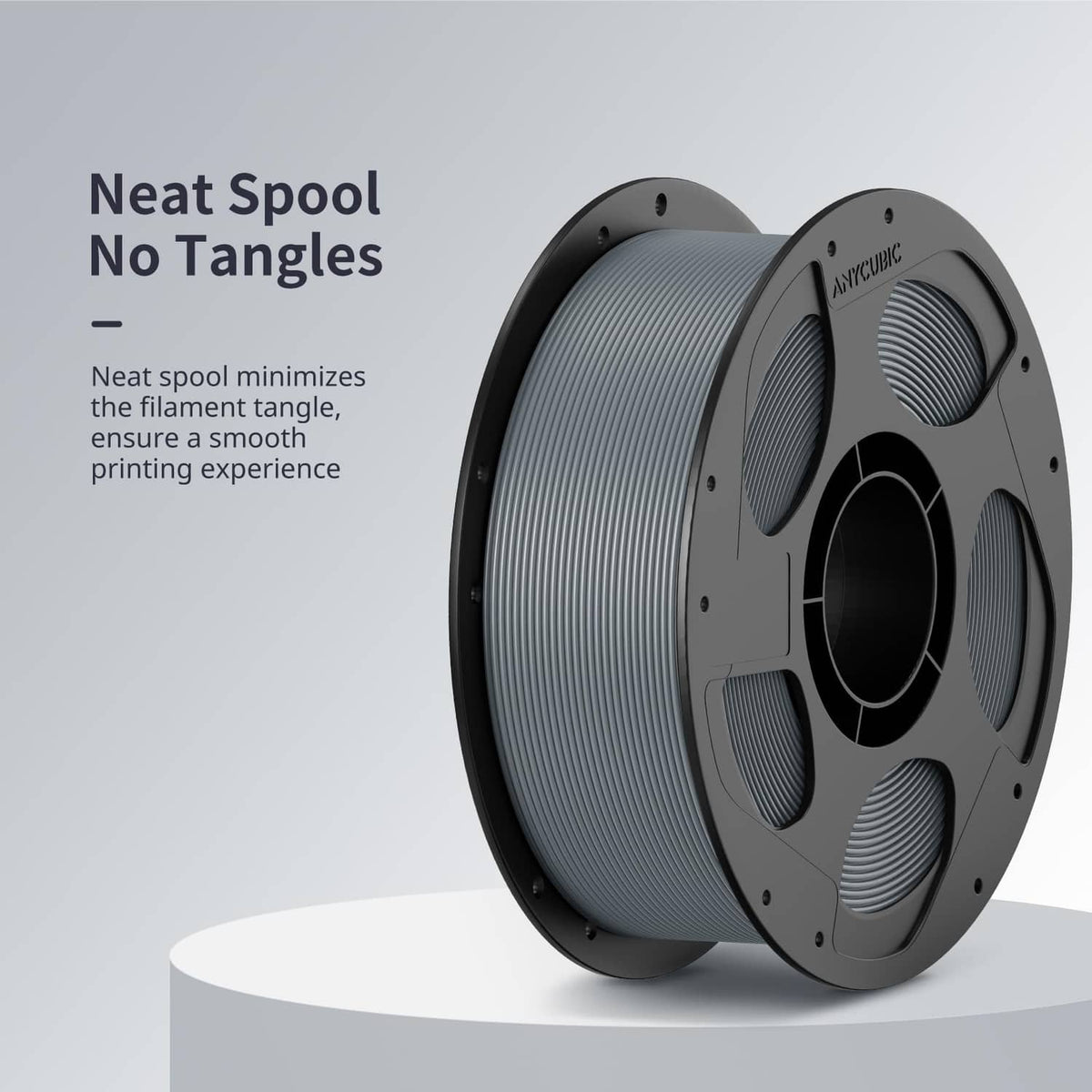 Grey PLA filament neatly wound on dual-sided spool, visible layered coils