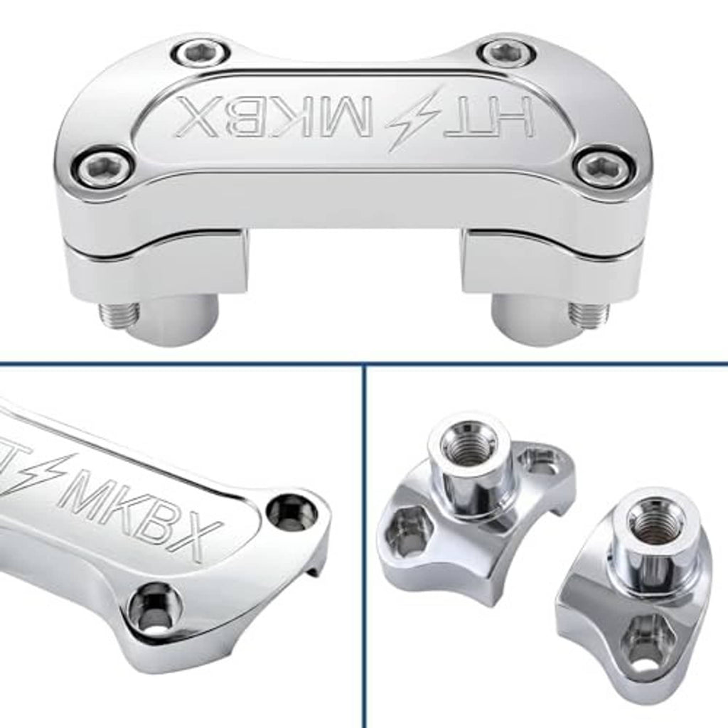 Close-up of chrome handlebar riser clamp with embossed markings and four mounting bolts