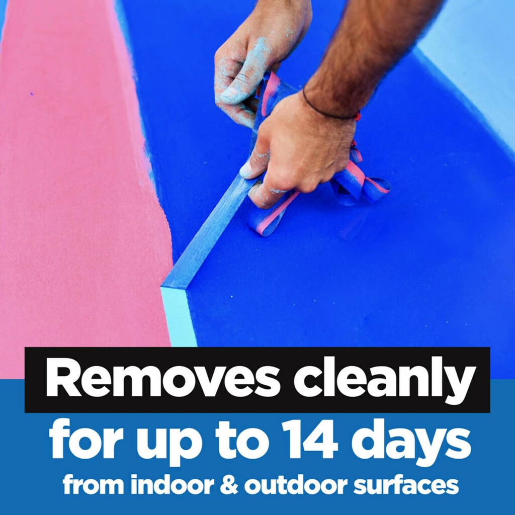 Hands press blue painter's tape along an edge for clean removal