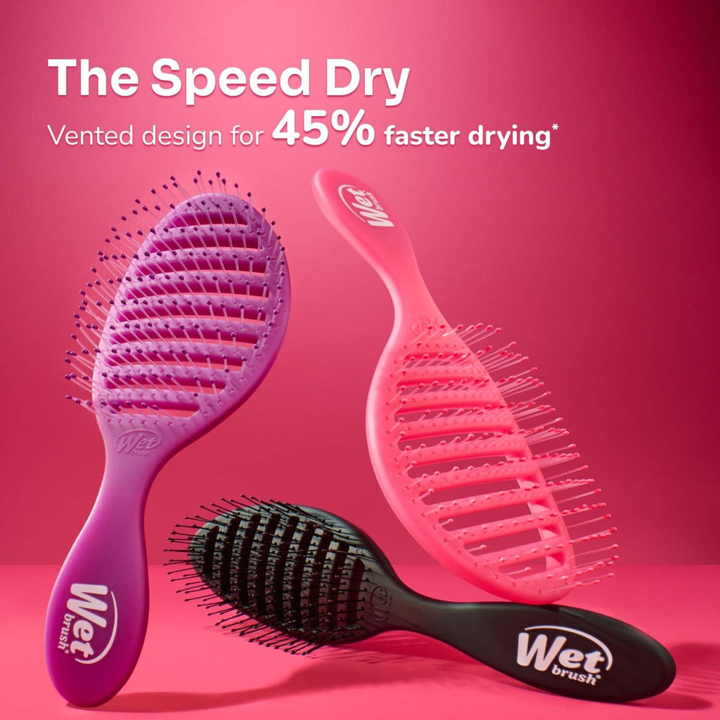 Two pink vented paddle hairbrushes with bristle rows and ergonomic handles