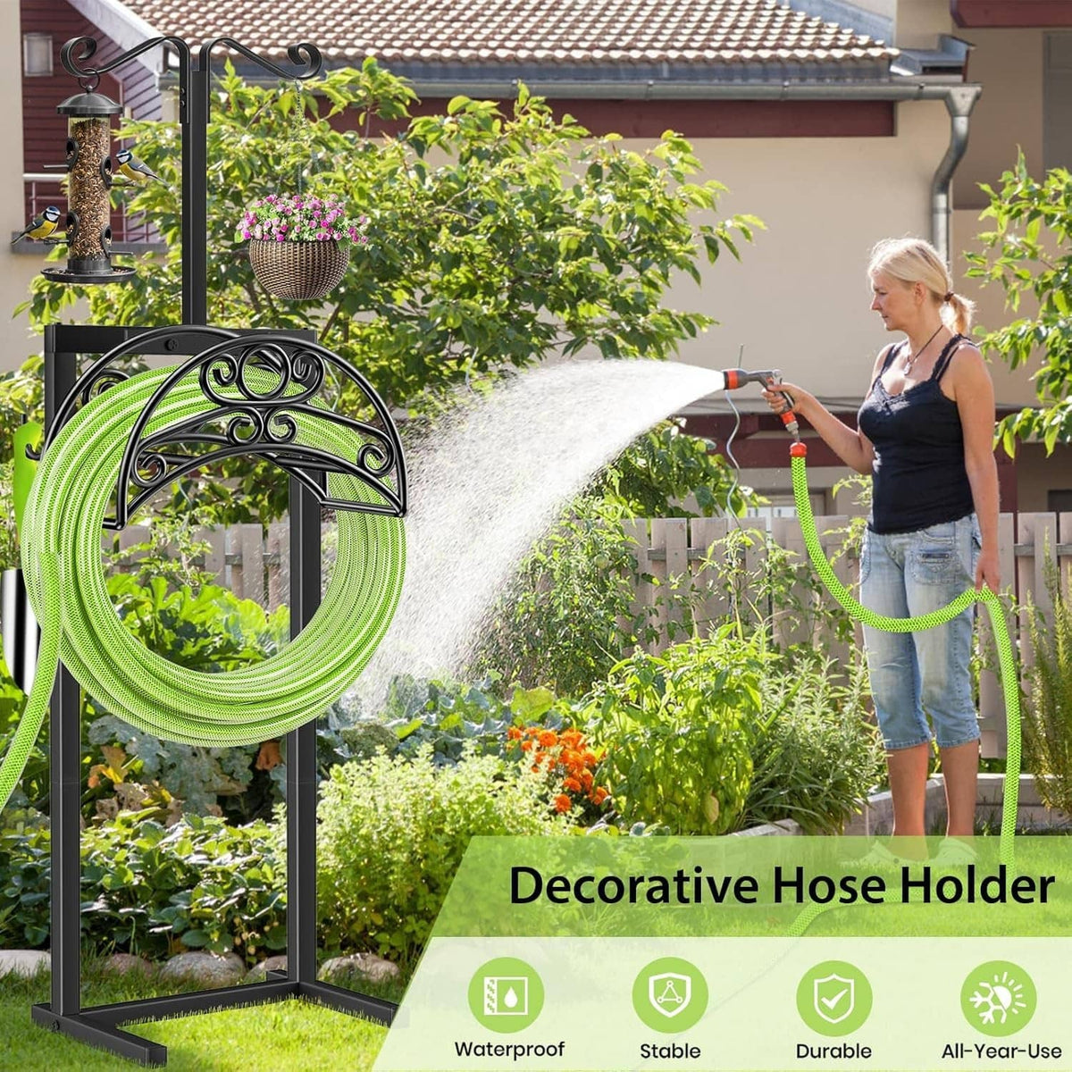 Black garden hose holder with green coiled hose and lantern tops for yard use