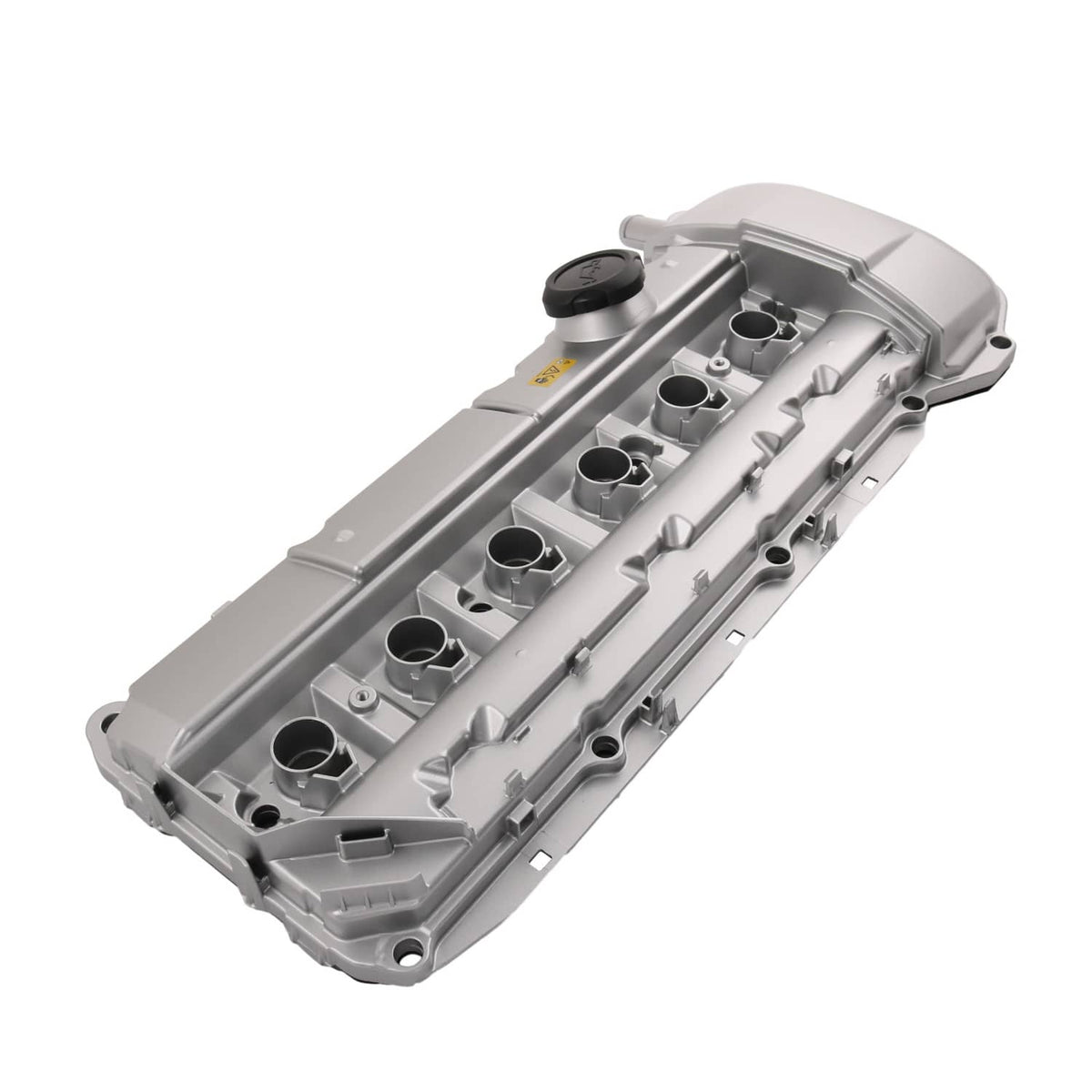 Aluminum engine valve cover, silver-gray underside detail with port openings and mounting tabs