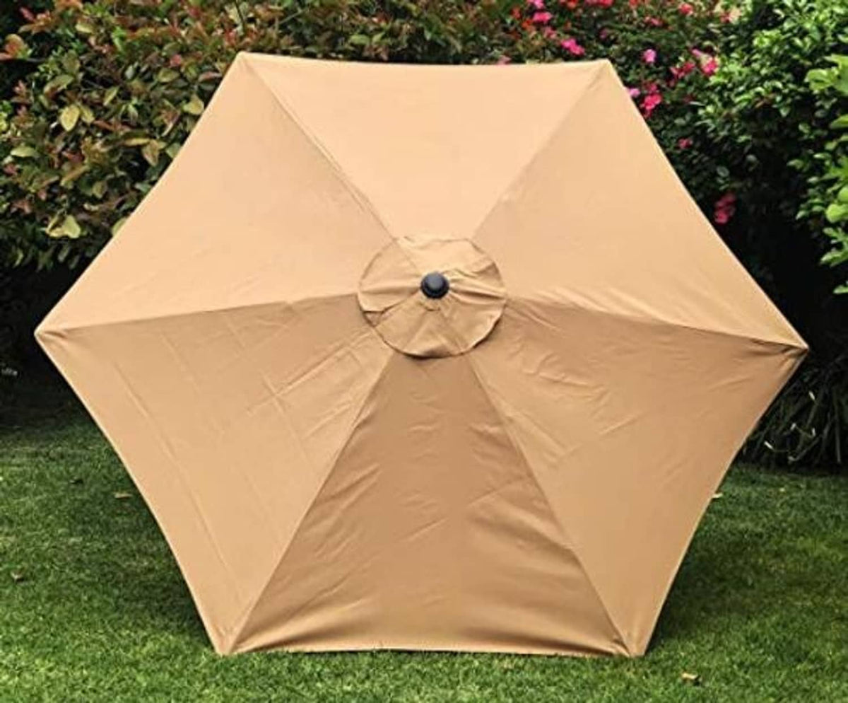Tan umbrella replacement canopy with buttoned center vent on grass