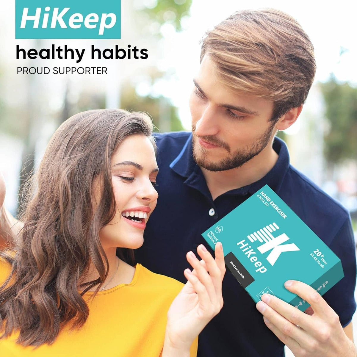 Hand exerciser six-pack boxes held by two people outdoors.