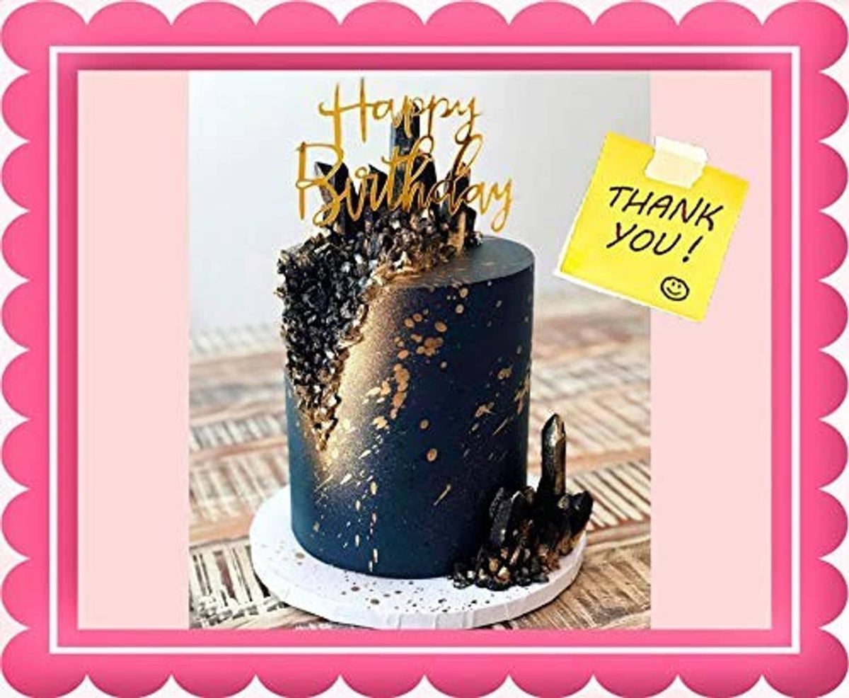 Blue cake with gold glitter sprinkles and a decorative birthday candle
