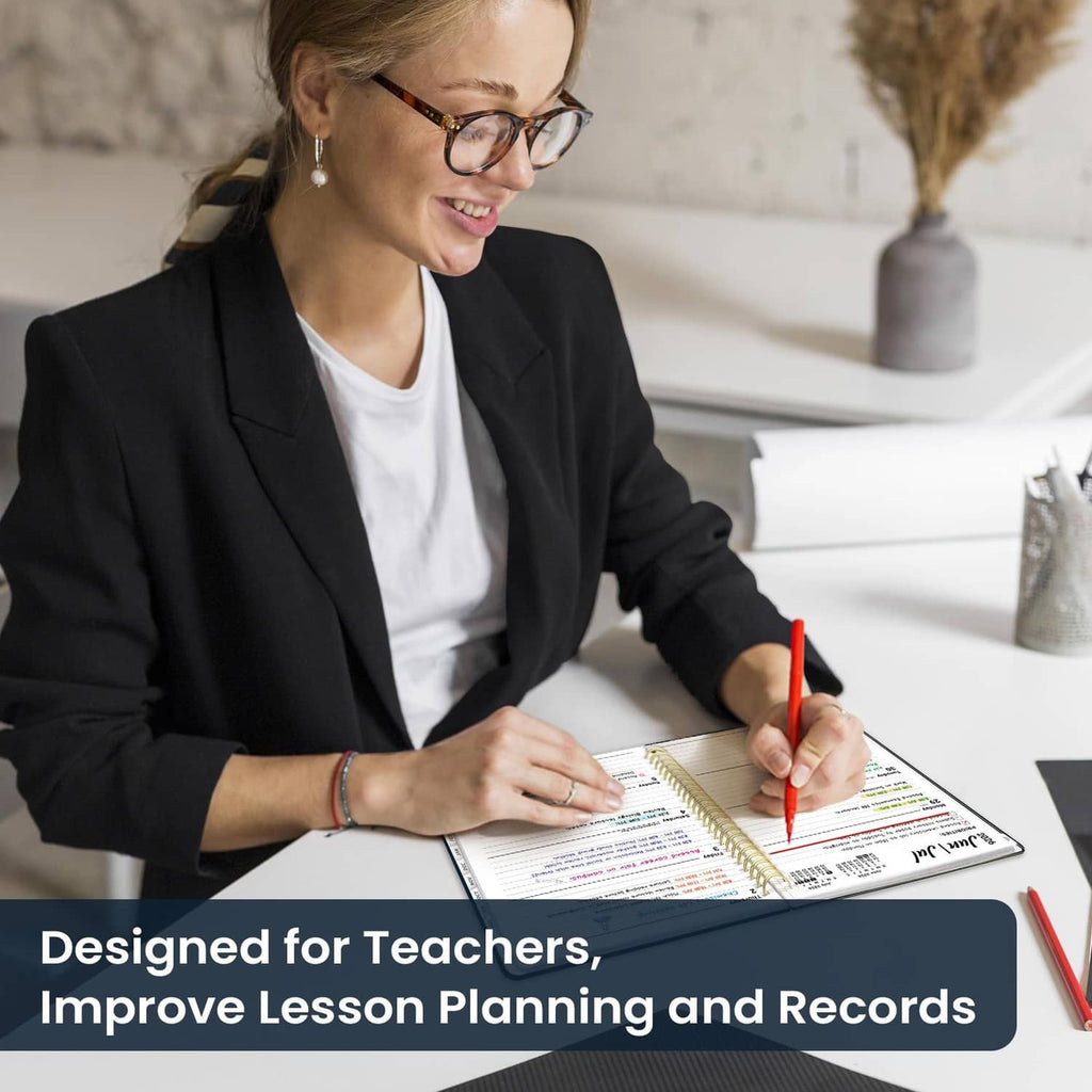 Teacher writing in an academic planner with tabbed lesson planning pages