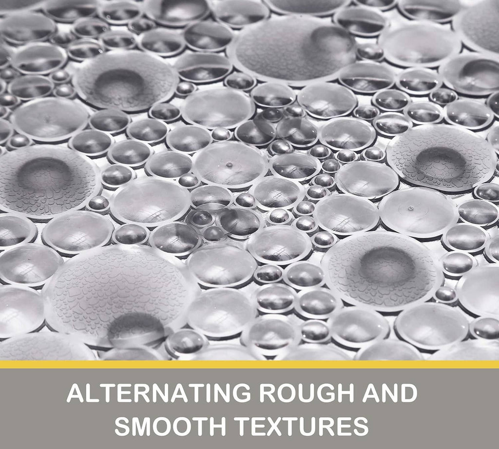 Pebble bath mat with raised bubble-and-stud texture for slip-resistant traction
