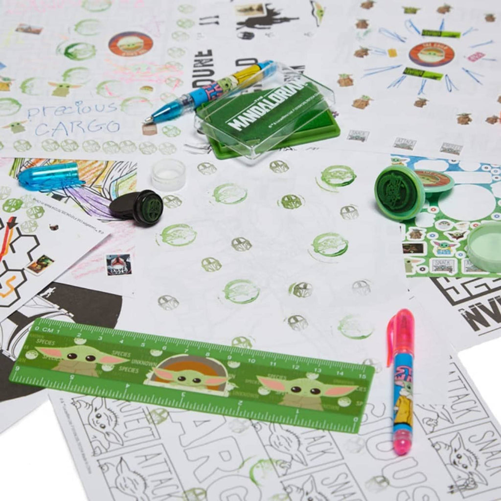 Sticker craft accessories with a green character ruler, stamps, ink pad, and stickers