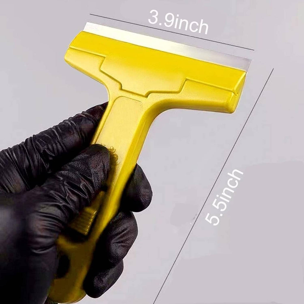 Yellow window scraper held in black gloves with exposed razor blade