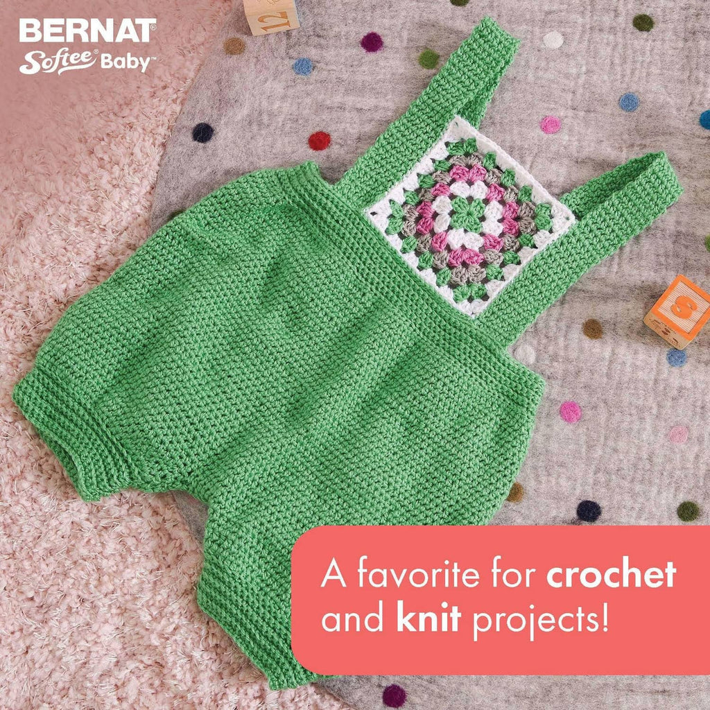 Green baby crochet-knit top with V-neck and square patch detail