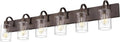 Six-light bathroom vanity light with dark bronze bar and clear glass cylinder shades