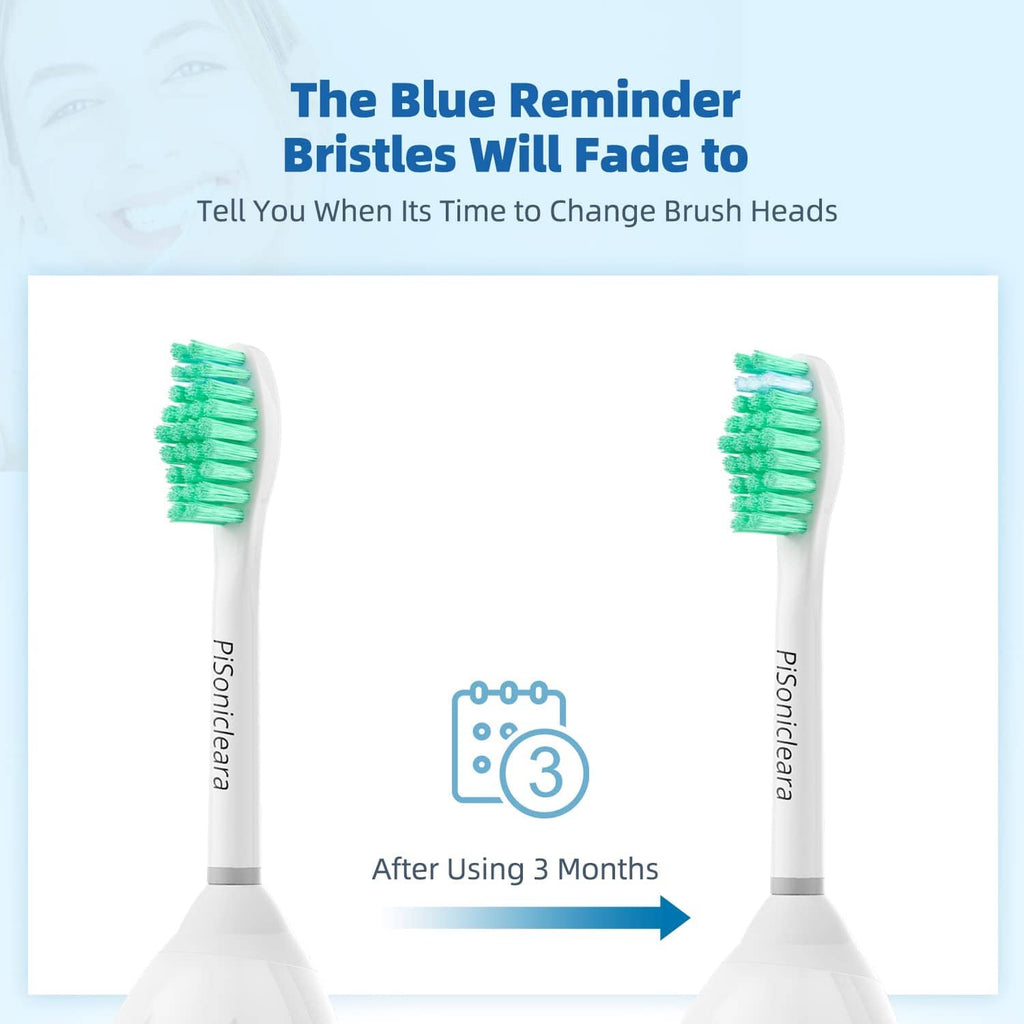 Two replacement toothbrushes with white handles and green bristle heads