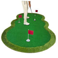 Golf putting green mat with three practice holes and red flags