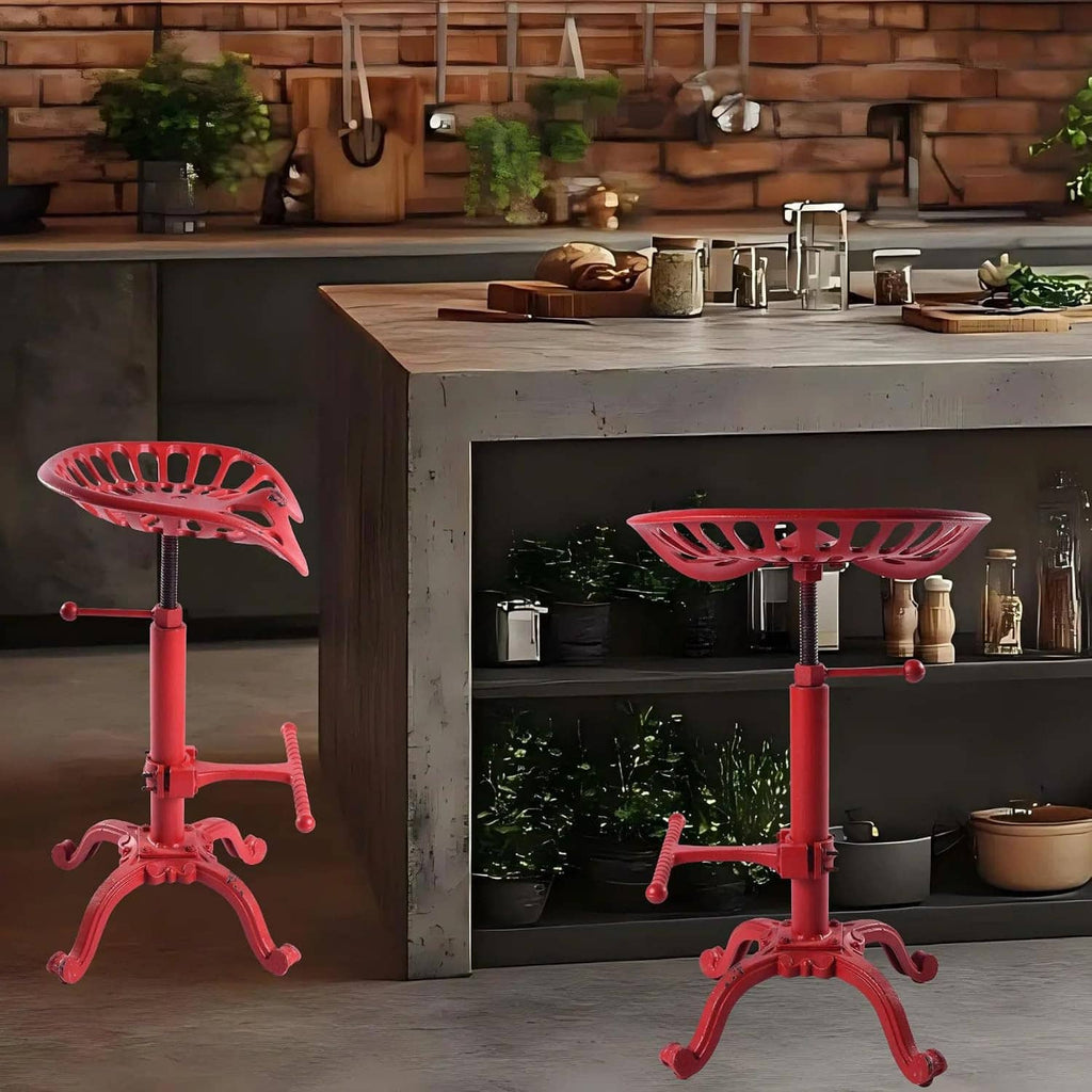 Two red tractor-seat adjustable bar stools with perforated seats and crank bases