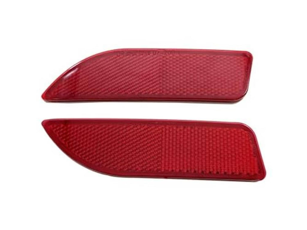 Red rear bumper reflector lights, angled close-up of textured lens surfaces