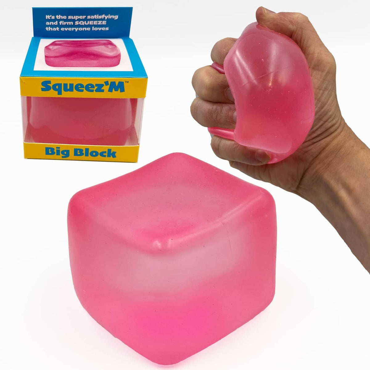 Pink squishy block cube stress toy held in hand