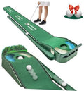 Green golf putting mat with side cup targets, hazard opening, and golf balls for practice.