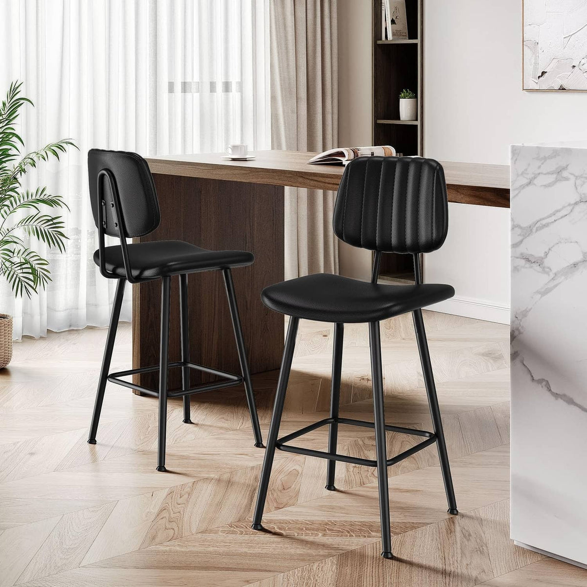 Set of two black counter-height bar stools with padded back, cushioned seats, and footrests.