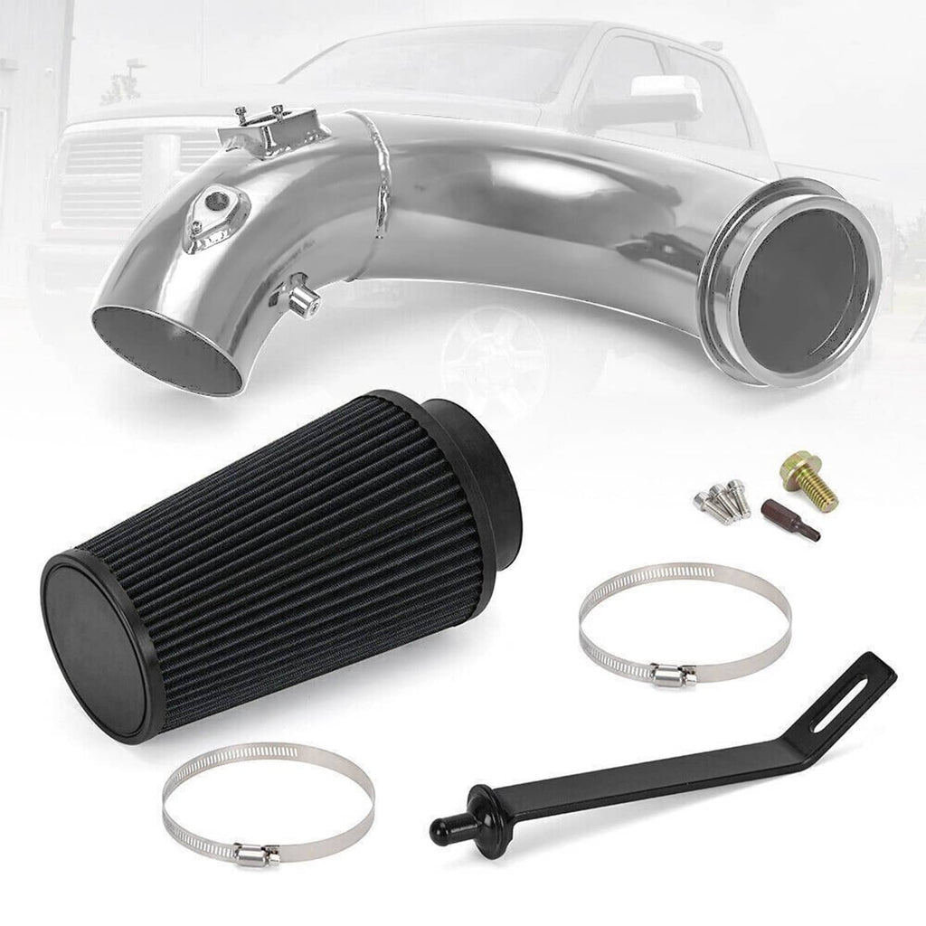Cold air intake kit laid out: black air filter, polished pipe, clamps, and bracket