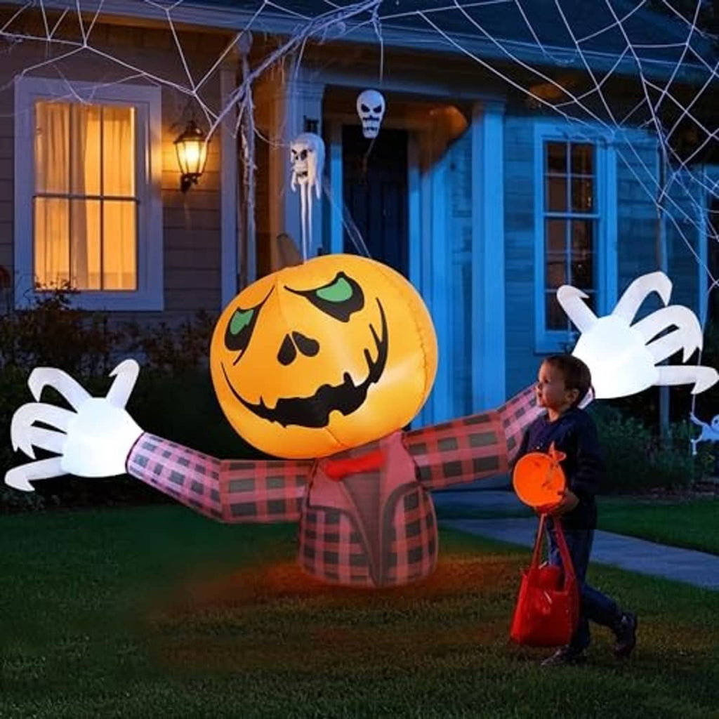 Inflatable orange jack-o-lantern pumpkin ghost with red plaid body and white extended hands