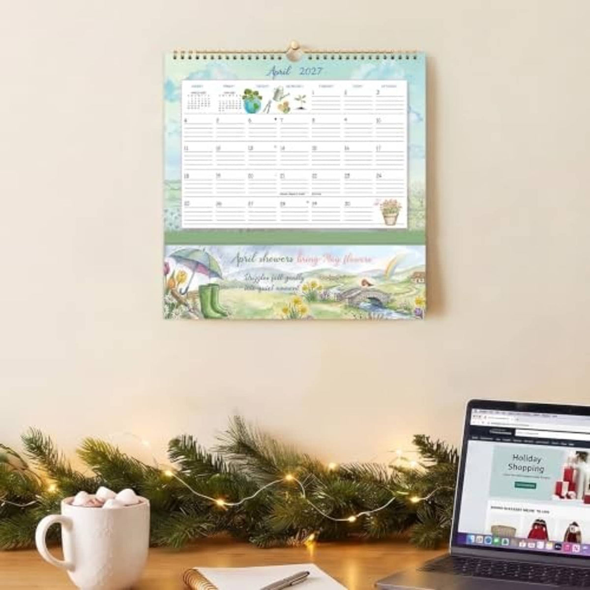Blue April 2027 wall calendar with monthly grid and landscape-themed cover illustration