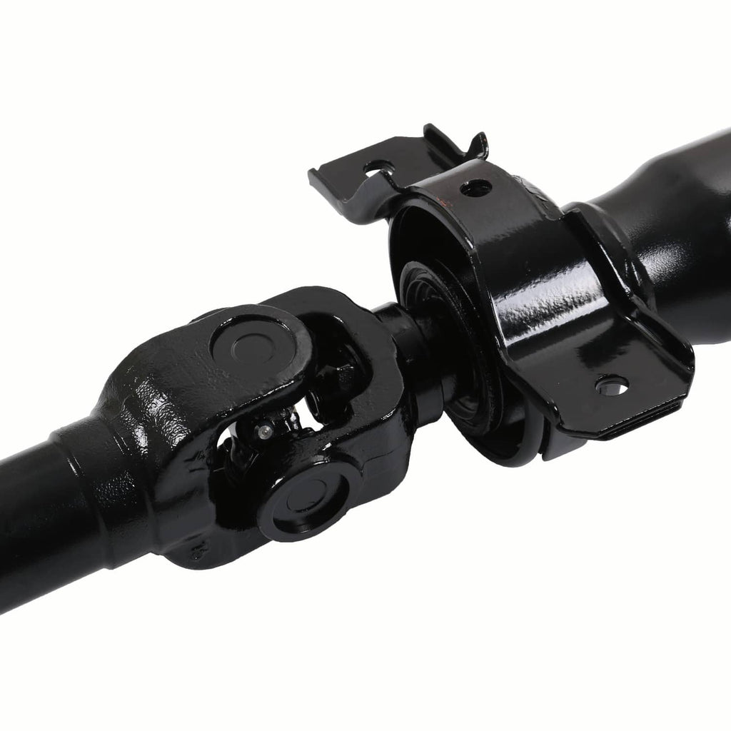 Close-up of black rear driveshaft prop shaft universal joint and mounting bracket