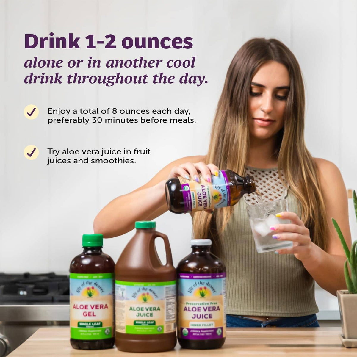 Aloe vera juice bottles on counter; one bottle poured into a glass