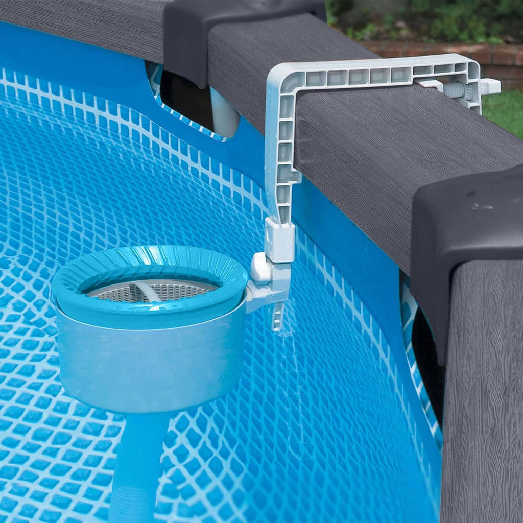 Pool skimmer with blue basket attached near the pool wall and mounting bracket