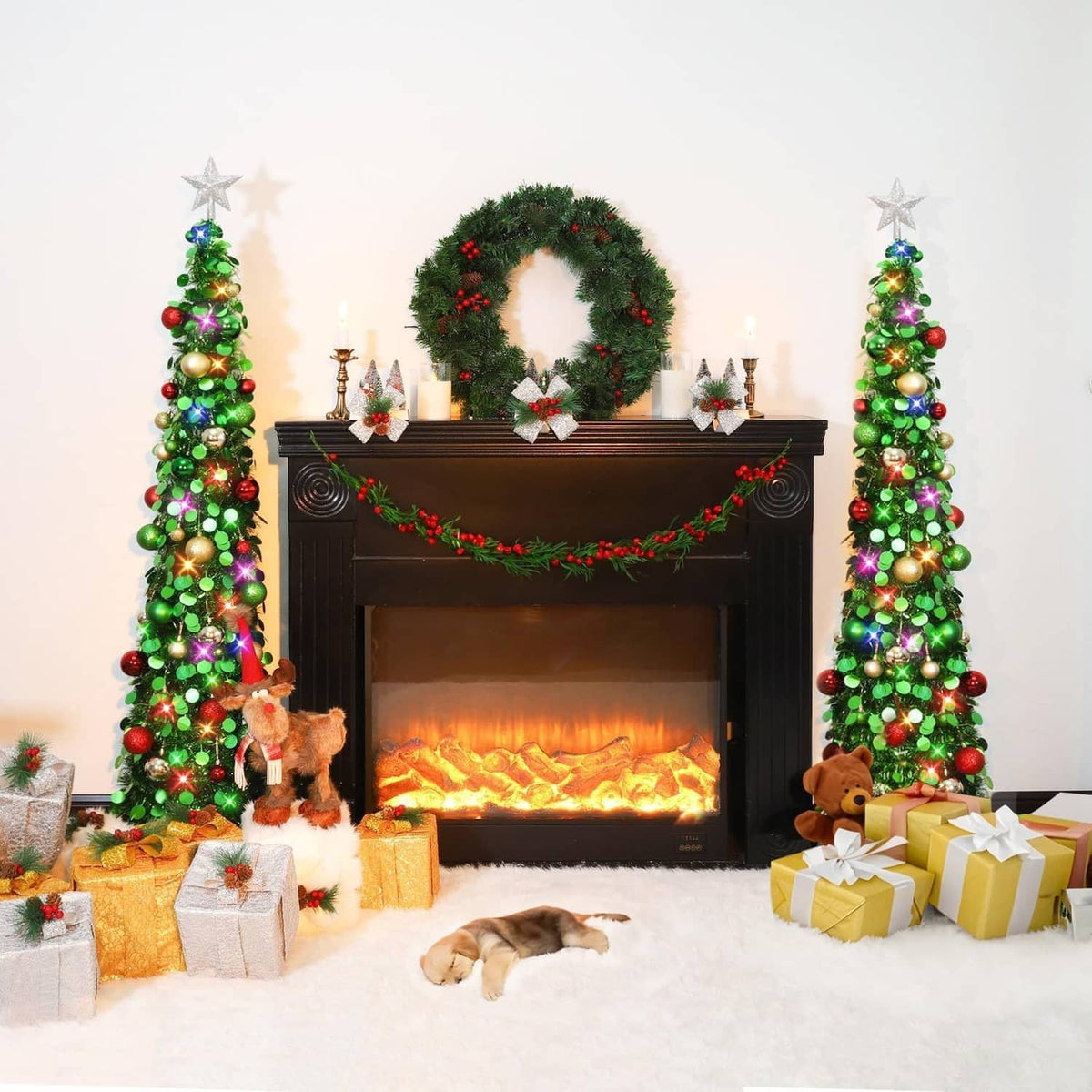 Two lit green pop-up Christmas trees with star toppers, ornaments, flanking a fireplace