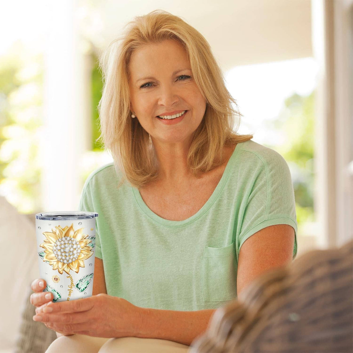 White 20 oz stainless tumbler with gold daisy and green butterfly artwork