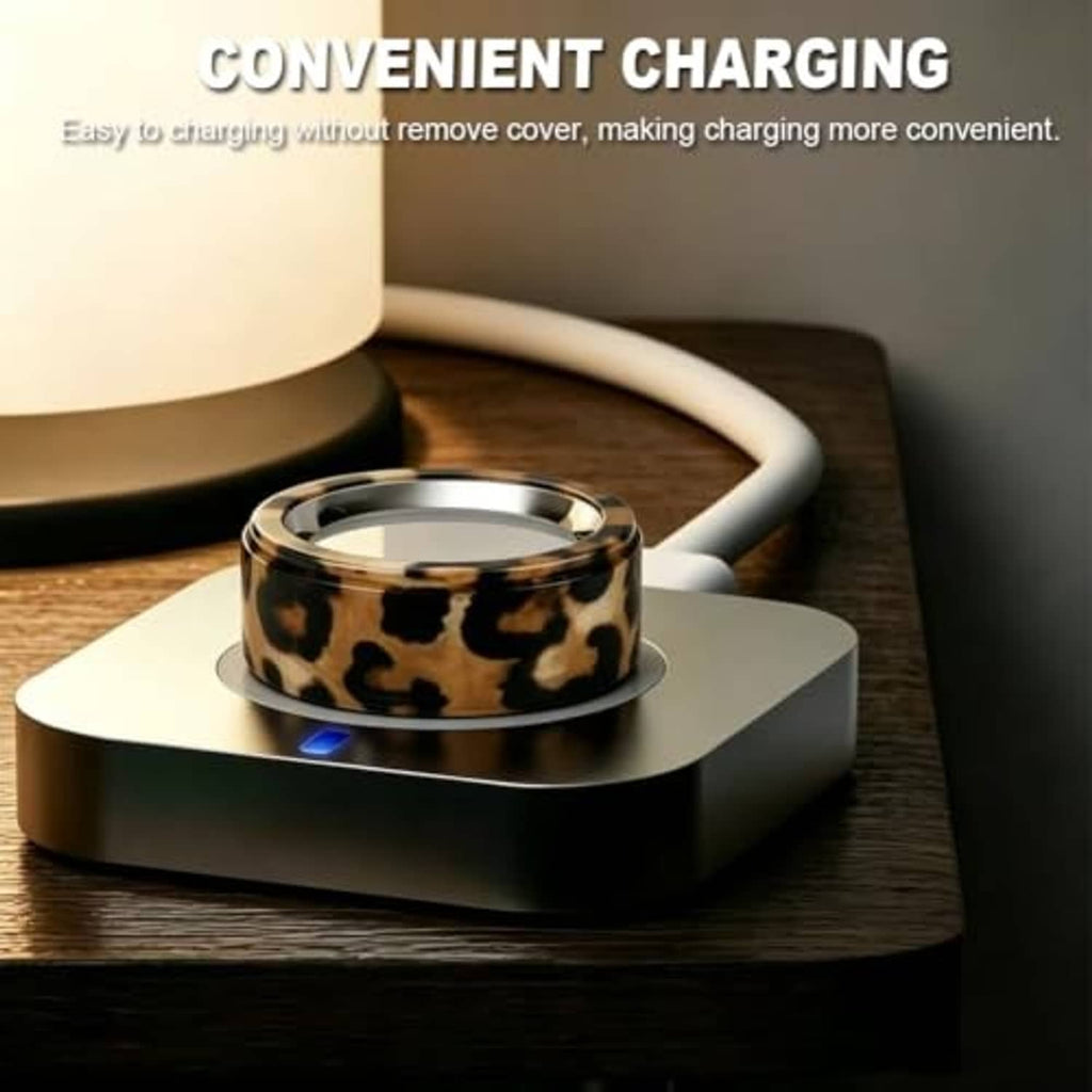 Cow print smart ring cover on charging dock base, protective silicone sleeve.