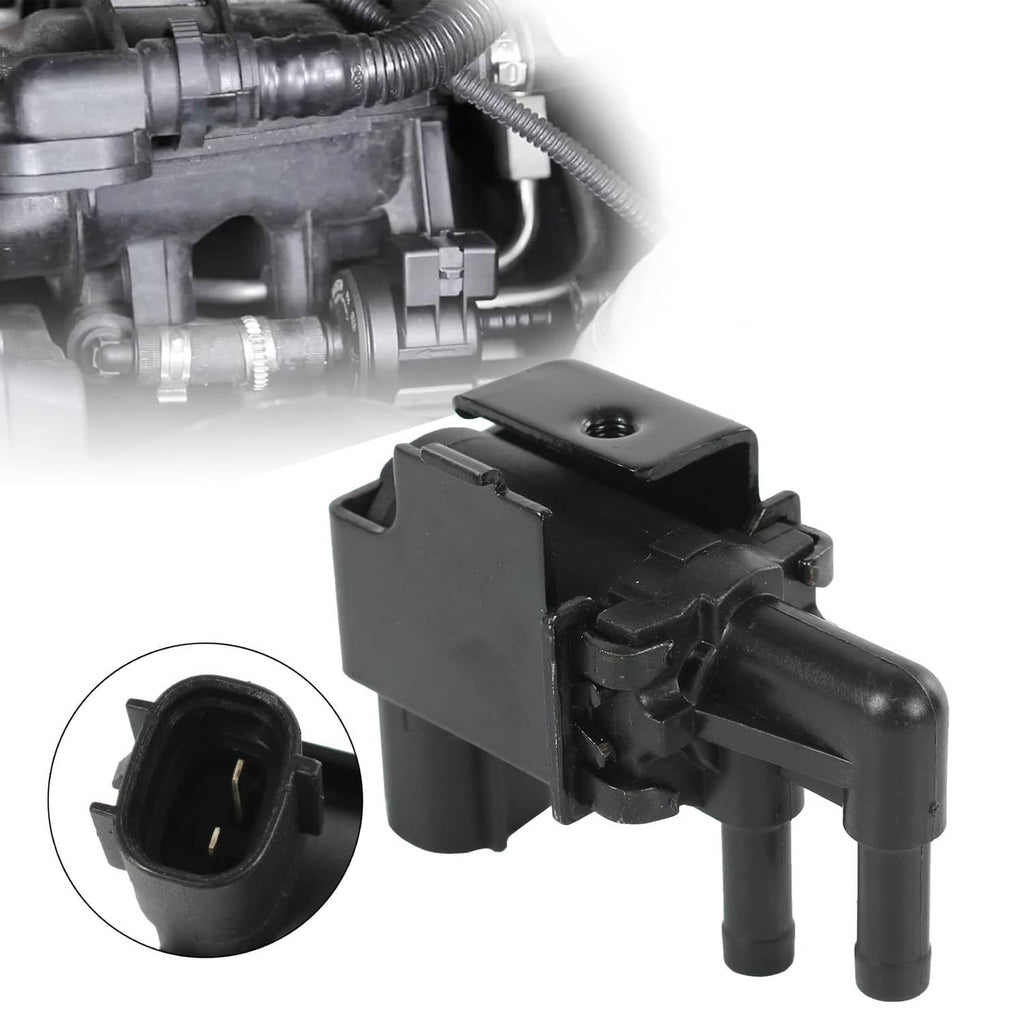 Black vacuum vent valve with two hose ports and electrical connector for automotive use