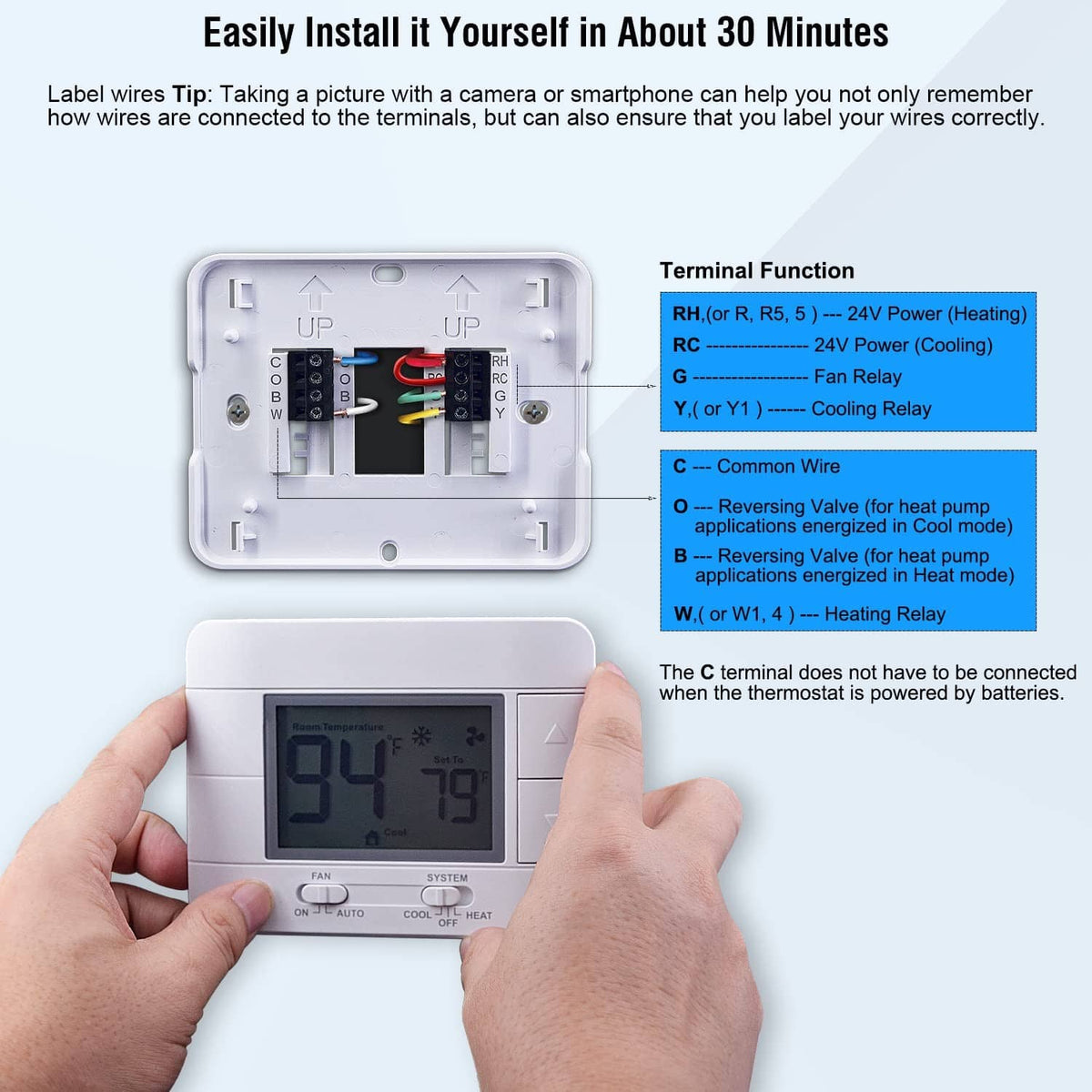White thermostat during wiring installation, showing terminal area and mounted base.