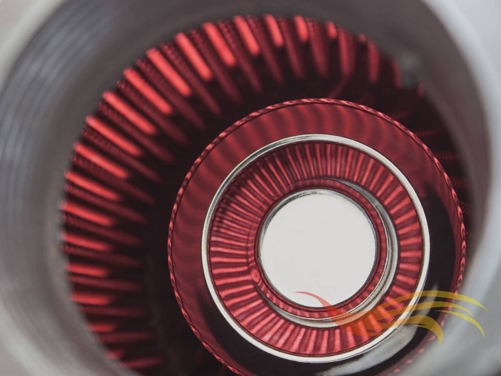 Close-up of red pleated cone air filter core with black and silver inner ring