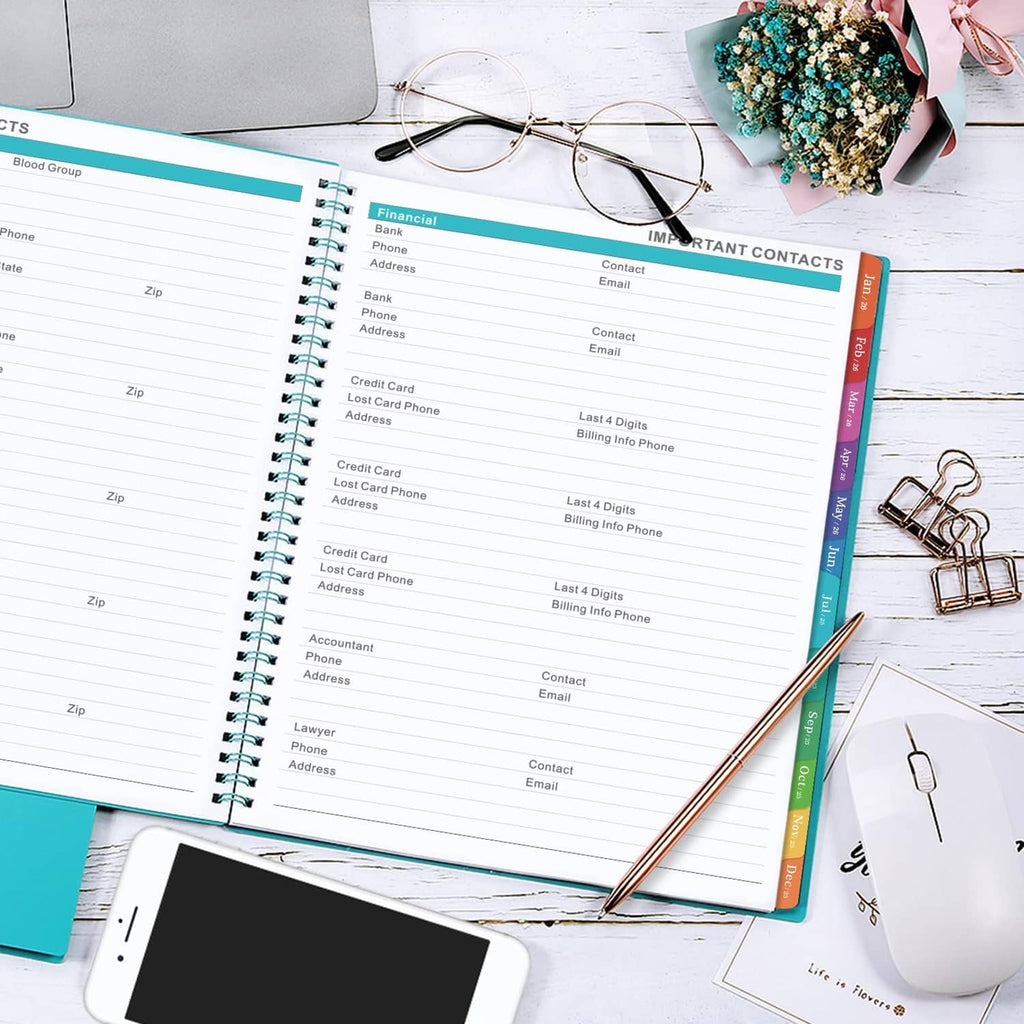 2025-2026 planner open to contacts and financial record tables with tabs