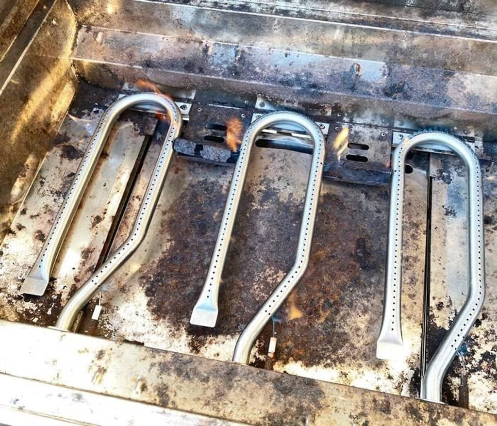 Gas grill burners installed in a firebox, U-shaped stainless tubes with mounting bases