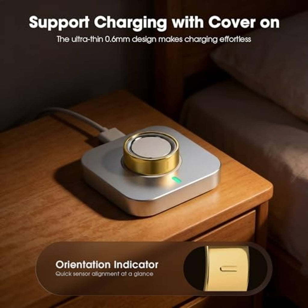 High-gloss Oura Ring cover in gold tone attached to charging base, size 8