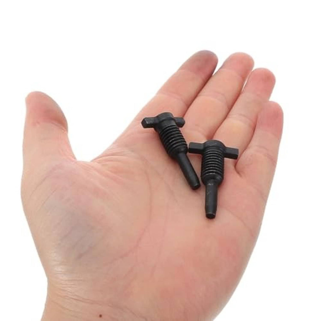 Black threaded oil release valve plugs held in an open hand