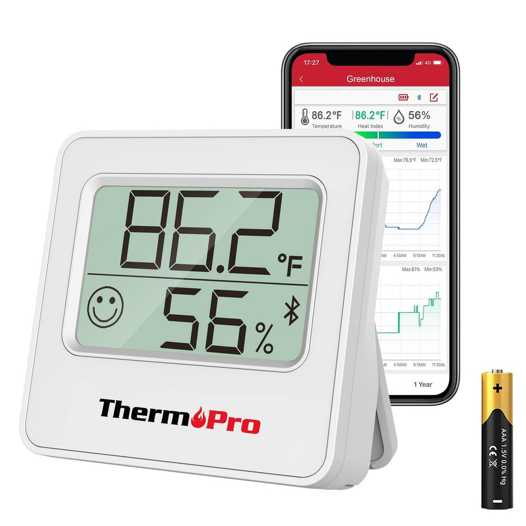 Silver digital hygrometer on stand display showing 86.2°F and 56% humidity